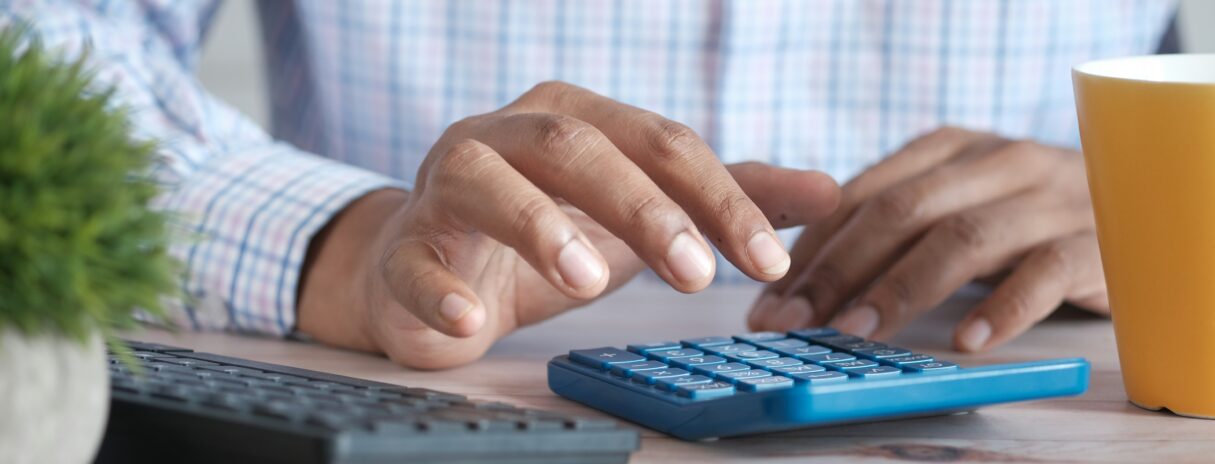 Man Holding Calculator